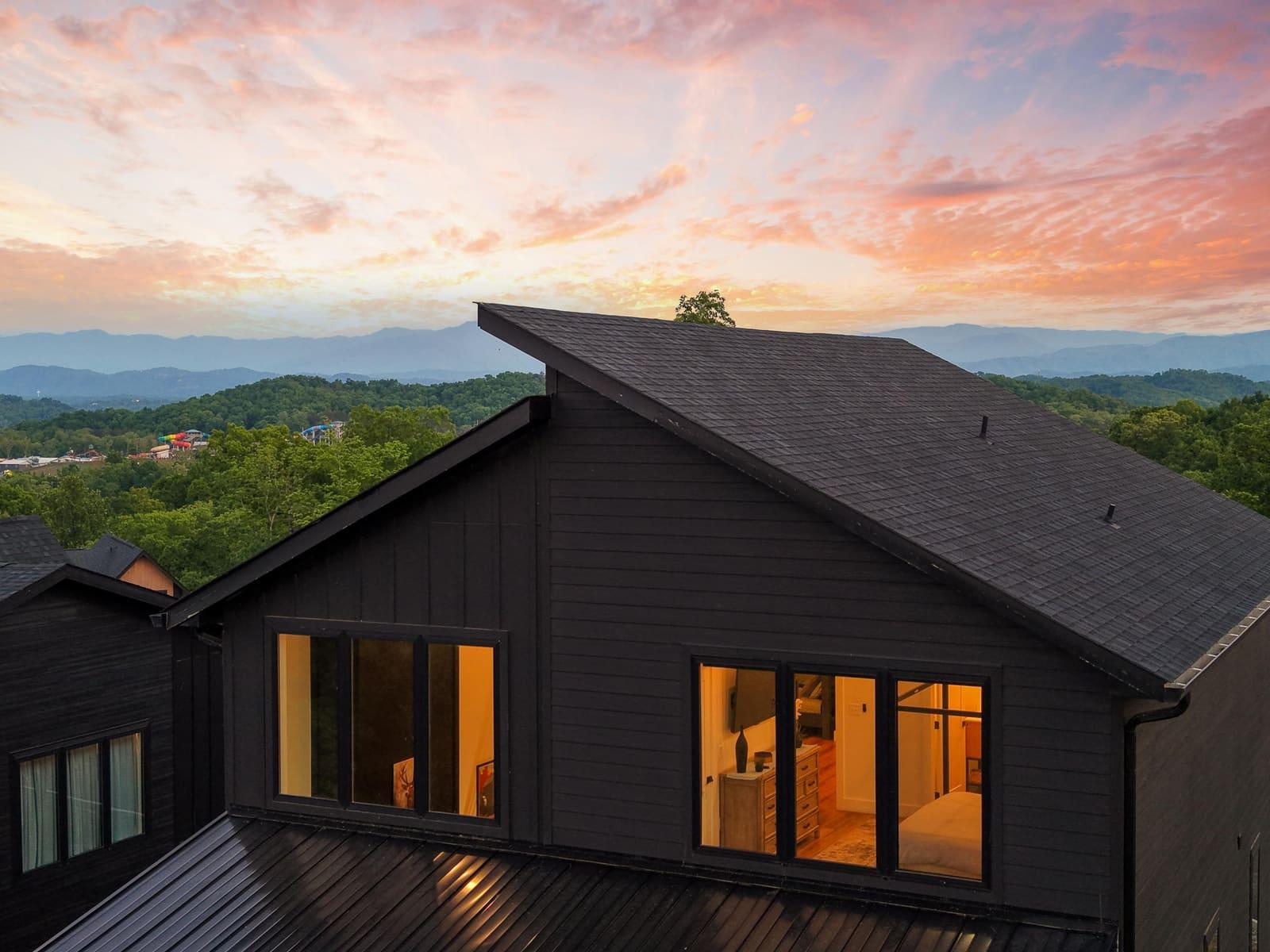 True twilight photograph of a modern exterior with warm interior light at dusk