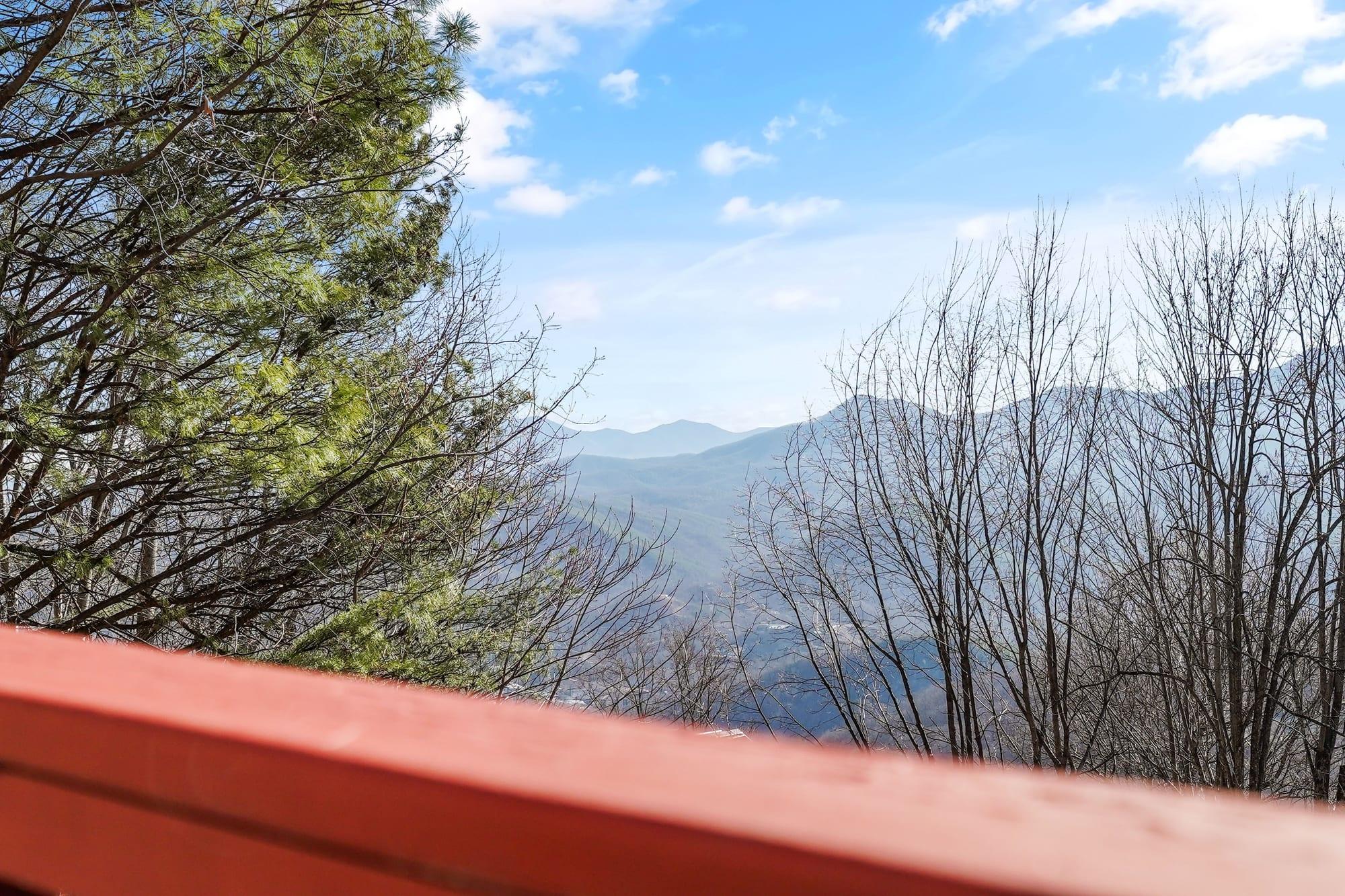 Smoky Mountains ridgeline seen over the cabin deck rail
