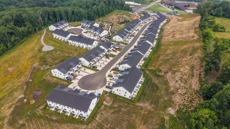 Drone aerial of the townhome community along a ridgeline
