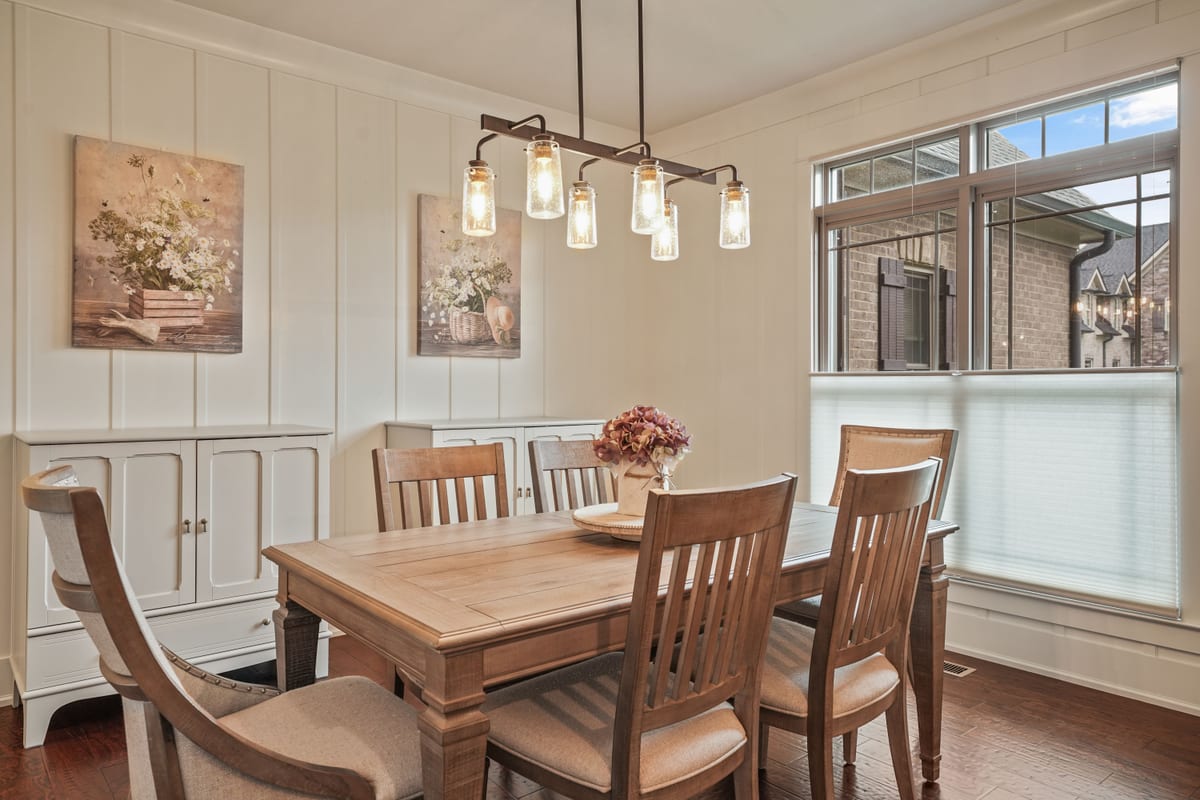 Dining nook with jar chandelier and built-in hutch