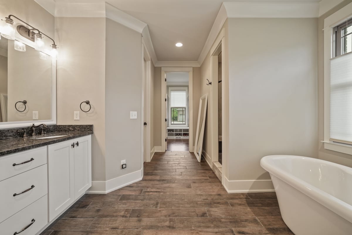 Freestanding tub on wood-look tile (detail crop)