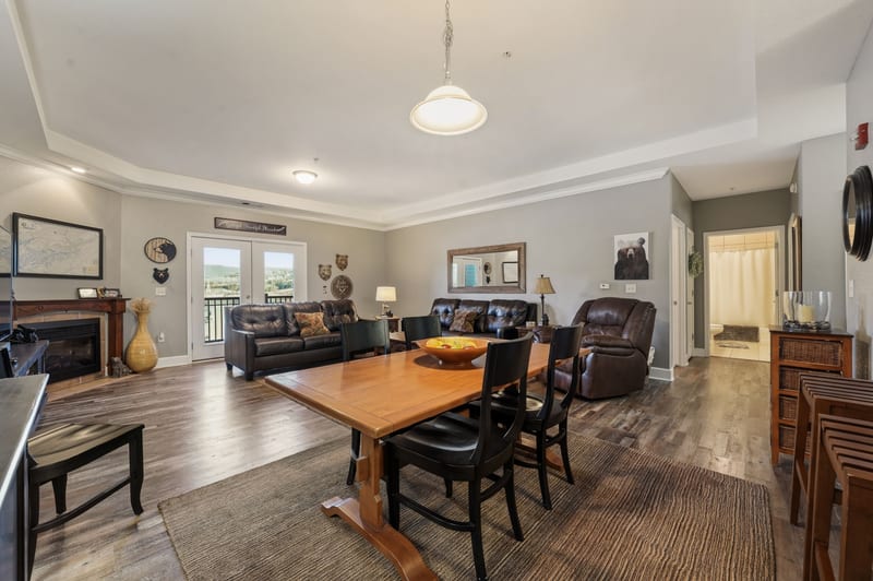 Condo living and dining room looking toward the lakeside balcony door