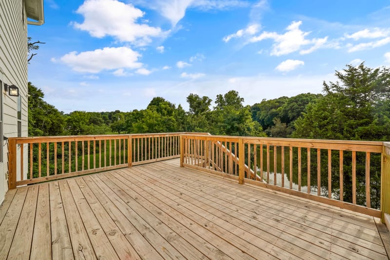 Large cedar deck overlooking the pond treeline