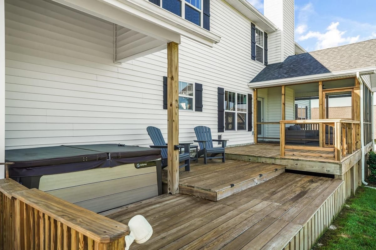 Wood deck with hot tub just off the screened porch