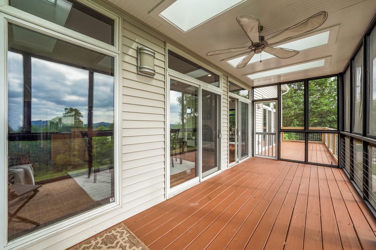 Screened porch with skylights and lounge seating (detail crop)
